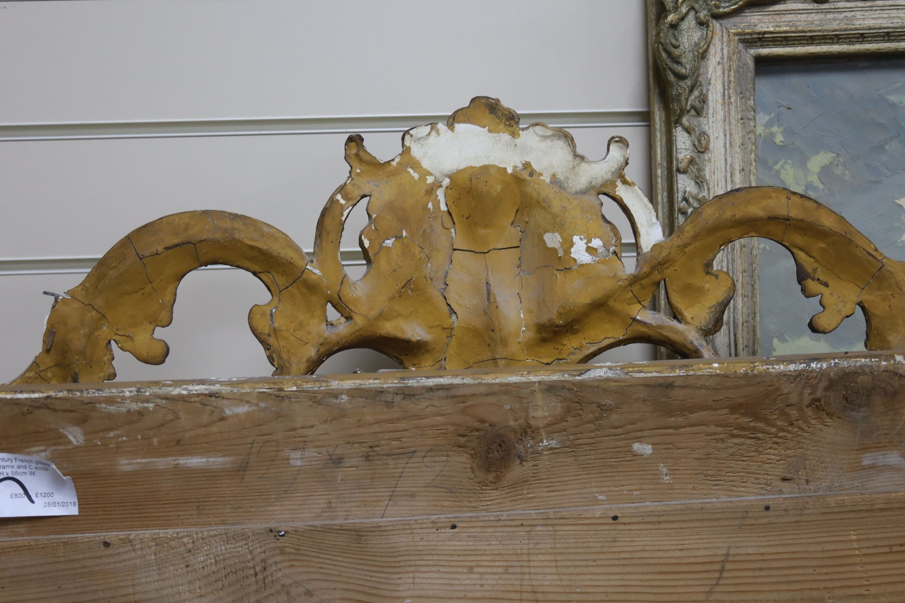 A 19th century French overmantel mirror, giltwood and gesso with channelled frame and scroll with cabochon crest detail, width 98cm, height 164cm